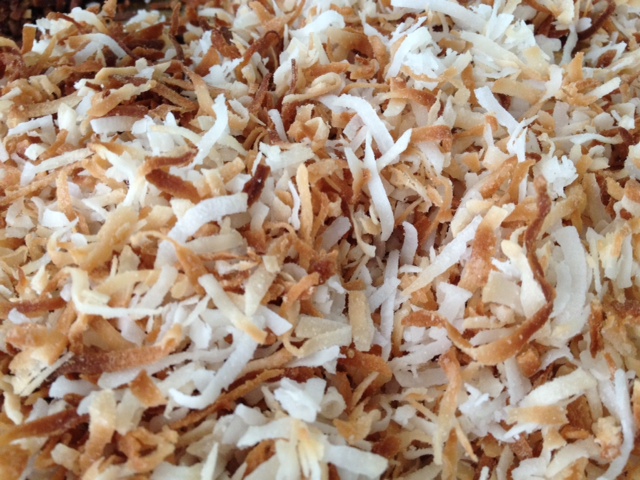 Spread sweetened coconut flakes on non-greased baking sheet. 250 oven. Done in 5-7 minutes.