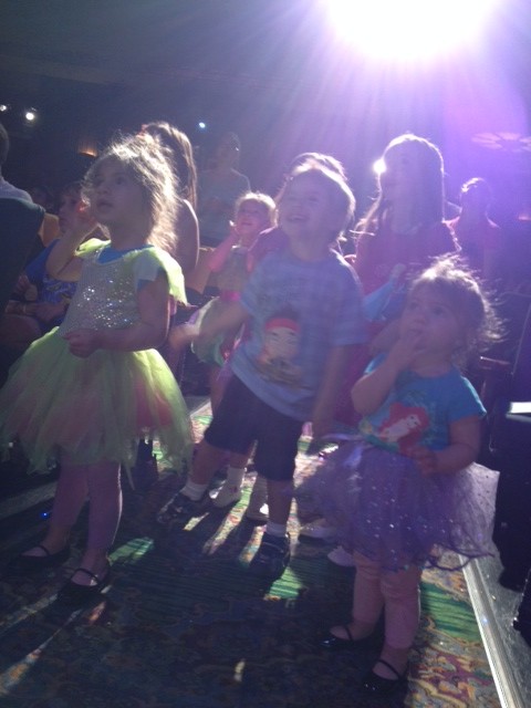 Dance party pre-show in the aisles. With a new friend (middle).