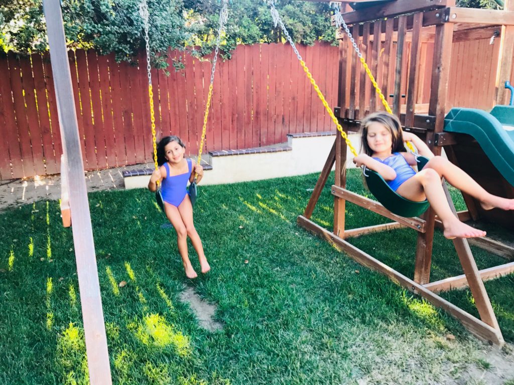 spring-blooms-sisters-daughters-swing-set